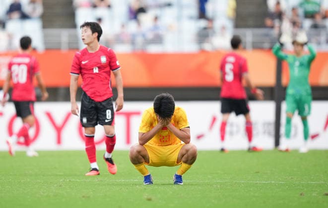 (260930) -- OSAKA, Sept. 30, 2026 -- Yang Xi of China reacts after the men s football semifinal between China and South Korea at 20th Asian Games Aichi-Nagoya 2026 in Osaka, Japan, Sept. 30, 2026. ) (SP)JAPAN-OSAKA-ASIAN GAMES-FOOTBALL-MEN S SEMIFINALS-CHN VS KOR LuixSiuxWai 