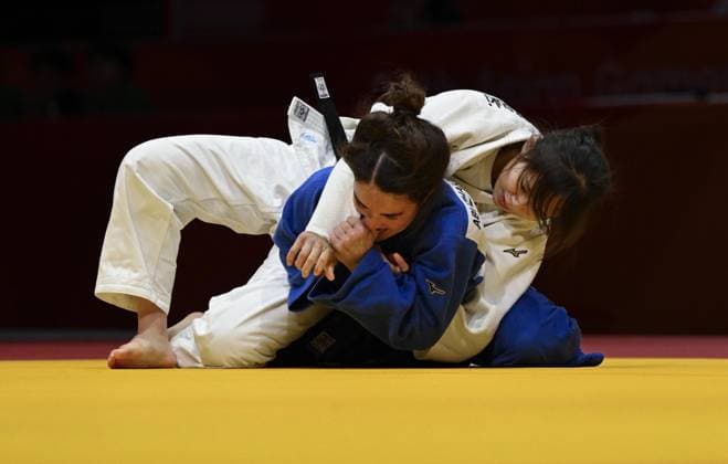 Aichi-Nagoya Asian Games: Judo Japan s Mitsuki Kondo (white) competes against Abiba Abuzhakynova of Kazakhstan in the Aichi-Nagoya Asian Games women s judo 48-kilogram final at Aichi International Arena in Nagoya, central Japan, on Sept. 30, 2026.  A14AA0005629483P