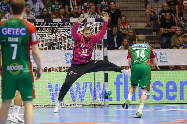 30.09.2026, xgox, Handball Opel HBL, SC Magdeburg - THW Kiel emspor, v.l. Andreas Wolff (Kiel, 33), Omar Ingi Magnusson (Magdeburg, 14) Magdeburg