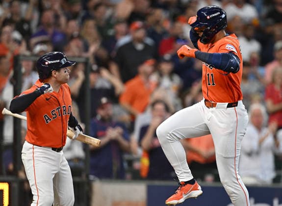 Houston Astros Cam Smith (11) celebrates with teammate Jose Altuve after hitting a solo home run against the Chicago White Sox in the second inning of an MLB, Baseball Herren, USA American League Wild Card game at Daikin Park in Houston, Texas, on Wednesday, September 30, 2026.  HOU20260930726 MARIAxLYSAKER