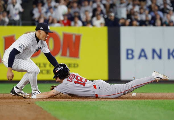 Boston Red Sox Nate Eaton (18) slides safely into second base for a double as New York Yankees shortstop George Lombard Jr. (96) defends in the third inning of an MLB, Baseball Herren, USA American League Wild Card game at Yankee Stadium in New York City, on Wednesday, September 30, 2026.  NYP20260930706 JOHNxANGELILLO