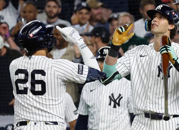 New York Yankees Luis Garcia Jr. (26) celebrates with teammates after hitting a solo home run against the Boston Red Sox in the fourth inning of an MLB, Baseball Herren, USA American League Wild Card game at Yankee Stadium in New York City, on Wednesday, September 30, 2026.  NYP20260930709 JOHNxANGELILLO