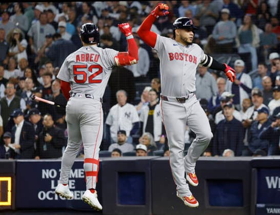 Boston Red Sox Willson Contreras (40) celebrates with Wilyer Abreu (52) after hitting a solo home run against the New York Yankees in the sixth inning of an MLB, Baseball Herren, USA American League Wild Card game at Yankee Stadium in New York City, on Wednesday, September 30, 2026.  NYP20260930717 JOHNxANGELILLO