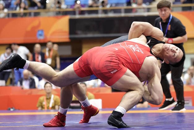 (261001) -- NAGOYA, Oct. 1, 2026 -- Wang Zegang (top) of China competes with Islam Yevloyev of Kazakhstan during their Men s Greco-Roman 97kg 1 8 Final Bout of Wrestling at the 20th Asian Games Aichi-Nagoya 2026 in Nagoya, Japan, Oct. 1, 2026. ) (SP)JAPAN-NAGOYA-ASIAN GAMES-WRESTLING-MEN S GRECO-ROMAN 97KG-1 8 FINALS LongxLei 