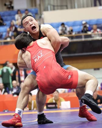 (261001) -- NAGOYA, Oct. 1, 2026 -- Wang Zegang (top) of China competes with Islam Yevloyev of Kazakhstan during their Men s Greco-Roman 97kg 1 8 Final Bout of Wrestling at the 20th Asian Games Aichi-Nagoya 2026 in Nagoya, Japan, Oct. 1, 2026. ) (SP)JAPAN-NAGOYA-ASIAN GAMES-WRESTLING-MEN S GRECO-ROMAN 97KG-1 8 FINALS LongxLei 