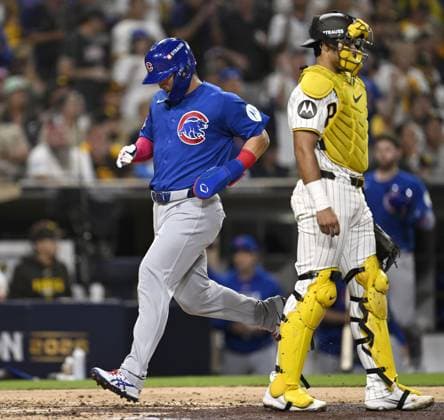 Baseball: Wild Card Series between Cubs and Padres Chicago Cubs right fielder Seiya Suzuki scores on an RBI single past San Diego Padres catcher Ethan Salas in the fourth inning of Game 2 of the best-of-three National League Wild Card Series at Petco Park in San Diego, California, on Sept. 30, 2026.  A14AA0005629565P