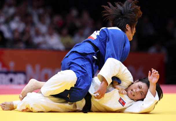 (261001) -- NAGOYA, Oct. 1, 2026 -- Japan s Tanioka Narumi (top) competes with Kim Ji Hye of the Democratic People s Republic of Korea (DPRK) during the women -63kg final of Judo at the 20th Asian Games Aichi-Nagoya 2026 in Nagoya, Japan, Oct. 1, 2026. ) (SP)JAPAN-NAGOYA-ASIAN GAMES-JUDO-WOMEN -63KG YaoxQilin 