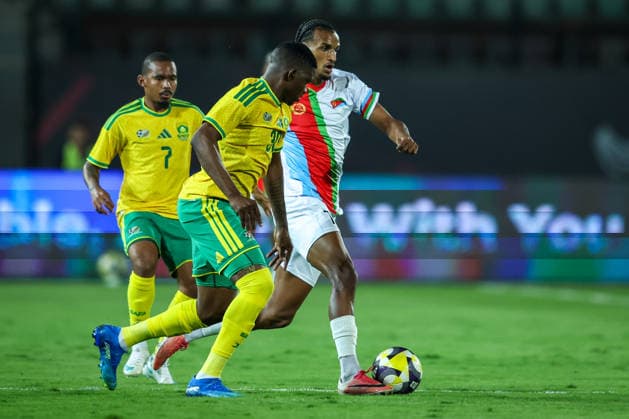 Eritrea v South Africa - CAF Africa Cup Of Nations Qualifiers Filmon Gebregziabhier Rezene of Eritrea battles for possession with Bathusi Jurry Aubaas of South Africa during the CAF Africa Cup of Nations qualifiers match between Eritrea and South Africa at Al Salam Stadium on September 30, 2026. Cairo Egypt  Copyright: xAymanxArefx originalFilename:aref-notitle260930_npjJs.jpg