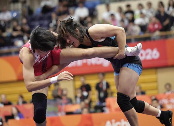 (261001) -- NAGOYA, Oct. 1, 2026 -- Zhang Qi (R) of China competes with Pai Hsin-ping of Chinese Taipei during the women s 62kg bronze medal match of Wrestling at the 20th Asian Games Aichi-Nagoya 2026 in Nagoya, Japan, Oct. 1, 2026. ) (SP)JAPAN-NAGOYA-ASIAN GAMES-WRESTLING-WOMEN S 62KG LongxLei 