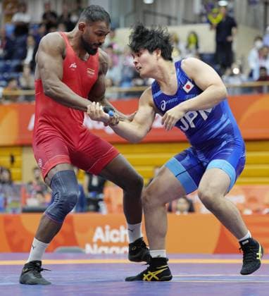 Aichi-Nagoya Asian Games: Wrestling Japan s Yuri Nakazato (blue) competes en route to beating Nitesh of India in the Aichi-Nagoya Asian Games men s wrestling Greco-Roman 97-kilogram final at Nagoya City Inae Sports Center in Nagoya, central Japan, on Oct. 1, 2026.  A14AA0005629657P