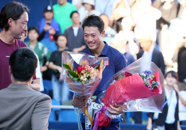 October 1, 2026, Tokyo, Japan - Japan s Kei Nishikori (R) receives flower bouquets from Shingo Kunieda and Go Soeda after the first round match of the Japan Open tennis championship at the Ariake Colosseum in Tokyo on Thursday, October 1, 2026. Nishikori was defeated by Frances Tiafoe of the United States and closed his professional carrier. (photo by Yoshio Tsunoda AFLO) Noxthirdxpartyxsales  aflo_352374104 YoshioxTsunodax