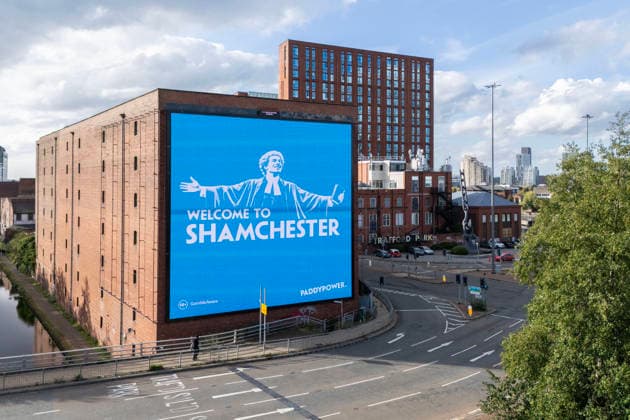 Manchester City Women v Real Madrid Women 1st October 2026 - UEFA Women s Champions League - League Phase - Manchester City v Real Madrid - A giant billboard advert by bookmakers Paddy Power reads Welcome To Shamchester , in reference to the guilty verdict reached by the Premier League in relation to the charges levied against the club - Photo: Simon Stacpoole Offside. Manchester UK Copyright: xSimonxStacpoolexOffside