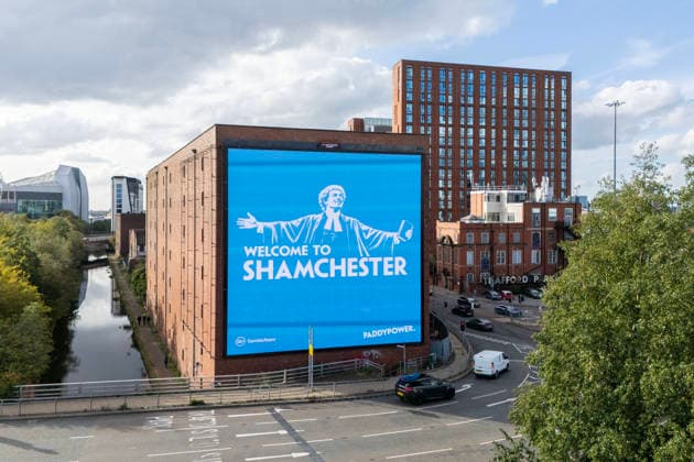 Manchester City Women v Real Madrid Women 1st October 2026 - UEFA Women s Champions League - League Phase - Manchester City v Real Madrid - A giant billboard advert by bookmakers Paddy Power reads Welcome To Shamchester , in reference to the guilty verdict reached by the Premier League in relation to the charges levied against the club - Photo: Simon Stacpoole Offside. Manchester UK Copyright: xSimonxStacpoolexOffside