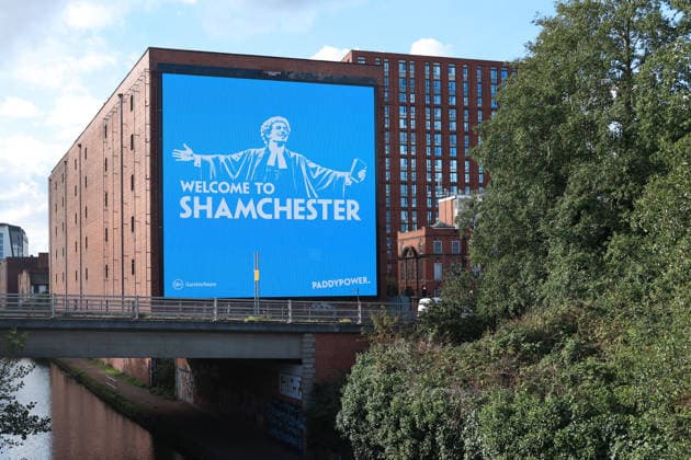Manchester City Women v Real Madrid Women 1st October 2026 - UEFA Women s Champions League - League Phase - Manchester City v Real Madrid - A giant billboard advert by bookmakers Paddy Power reads Welcome To Shamchester , in reference to the guilty verdict reached by the Premier League in relation to the charges levied against the club - Photo: Simon Stacpoole Offside. Manchester UK Copyright: xSimonxStacpoolexOffside
