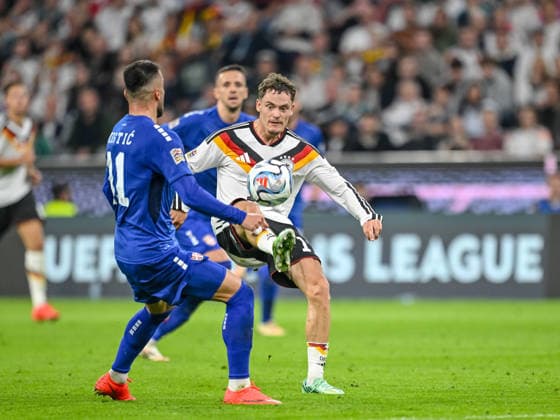 Filip Kostic (Serbia) and Florian Wirtz (Germany) battle for the ball during the UEFA Nations League 2026 27 group phase match between Germany and Serbia at Allianz Arena on October 1, 2026 in Munich, Germany. (Photo by Harry Langer DeFodi Images) -