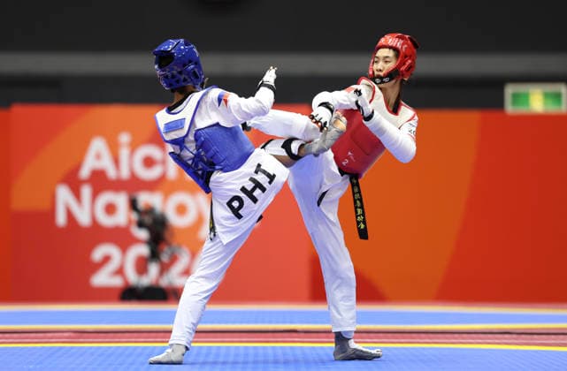 (261002) -- TOYOHASHI, Oct. 2, 2026 -- Ma Jingyue (R) of China competes with Tachiana Keizha Mangin of the Philippines during the women -49kg final of taekwondo at the 20th Asian Games Aichi-Nagoya 2026 in Toyohashi of Aichi Prefecture, Japan, Oct. 2, 2026. ) (SP)JAPAN-TOYOHASHI-ASIAN GAMES-TAEKWONDO-WOMEN -49KG WangxFei 