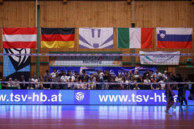 VOLLEYBALL - Coppa Pallavolo Senza Confini HARTBERG,AUSTRIA,02.OCT.26 - VOLLEYBALL - Coppa Pallavolo Senza Confini, TSV Hartberg vs ACH Volley Ljubljana. Image shows overview of flags and fans.  GEPAxpictures xChrisxBauer