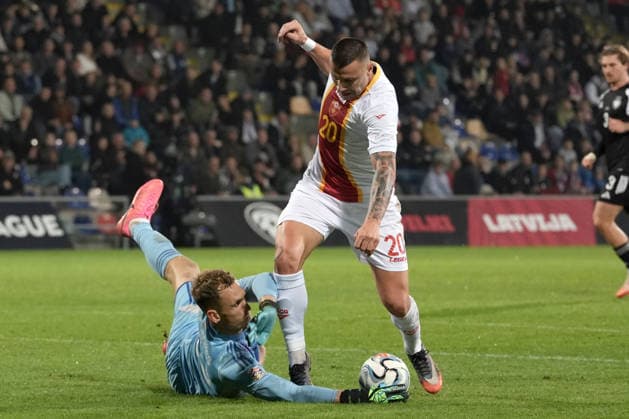 Goalkeeper Rihards Matrevics (23) of Latvia In action against Milutin Osmajic (20) of Montenegro during UEFA Nations League Group C2 football game between Latvia and Montenegro in Riga, Latvia, Fri, Oct. 2, 2026. Riga Latvia Copyright: xRomanxKoksarovx RKV09935.JPG
