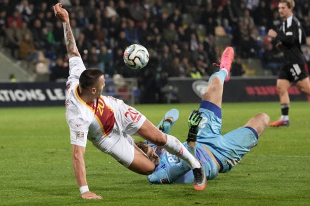 Goalkeeper Rihards Matrevics (23) of Latvia In action against Milutin Osmajic (20) of Montenegro during UEFA Nations League Group C2 football game between Latvia and Montenegro in Riga, Latvia, Fri, Oct. 2, 2026. Riga Latvia Copyright: xRomanxKoksarovx RKV09935.JPG