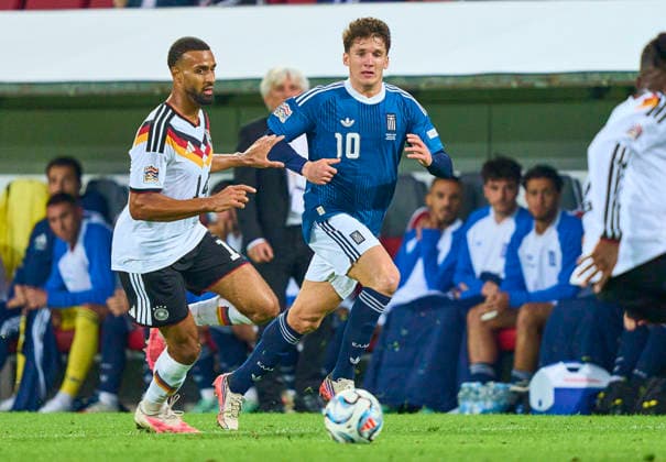 Josha Vagnoman of Germany compete for the ball, tackling, duel, header, zweikampf, action, fight against Christos Tzolis of Greece in the UEFA Nations League 2026 group stage match GERMANY - GREECE 0-1 in Season 2026 2027 at September 27, 2026 in Augsburg, Germany.