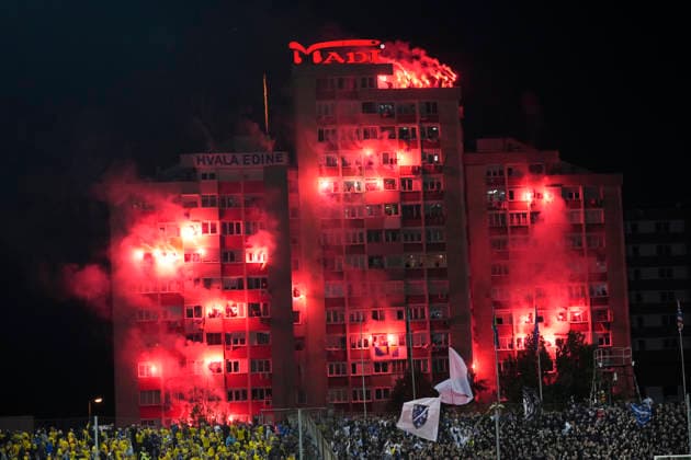 ZENICA, BOSNIA AND HERZEGOVINA 20261002 Fans who were not allowed into the stadium light flares outside during Friday s Nations League soccer match between Bosnia and Herzegovina and Sweden at Bilino Polje stadium in Zenica.