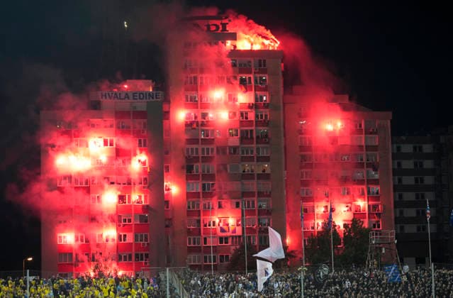 ZENICA, BOSNIA AND HERZEGOVINA 20261002 Fans who were not allowed into the stadium light flares outside during Friday s Nations League soccer match between Bosnia and Herzegovina and Sweden at Bilino Polje stadium in Zenica.