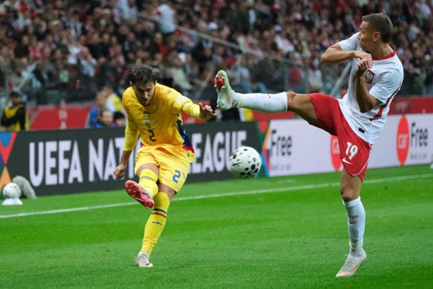 October 2, 2026, Warsaw, Masovian Voivodeship, Poland: Romania s ANDREI RATIU (2) in action against Poland s PRZEMYSLAW FRANKOWSKI (19) during a UEFA Nations League Group B4 match between the Polish and Romanian national teams at the PGE Narodowy Stadium in Warsaw. Poland went on to win against Romania 6 goals to 0. Soccer 2026: UEFA Nations League: Poland 6:0 Romania  - ZUMAk204 20261002_zip_k204_014 Copyright: xRomanxKozielx