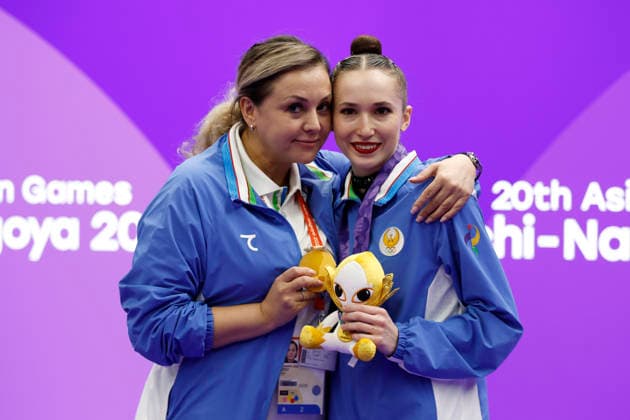 (261003) -- NAGOYA, Oct. 3, 2026 -- Gold medalist Takhmina Ikromova (R) of Uzbekistan poses for photos after the awarding ceremony for the Individual All-Around of Rhythmic gymnastics, Rhythmische Sportgymnastik, RSG at 20th Asian Games Aichi-Nagoya 2026 in Nagoya, Japan, Oct. 3, 2026. ) (SP)JAPAN-NAGOYA-ASIAN GAMES-RHYTHMIC GYMNASTICS-INDIVIDUAL ALL-AROUND-FINAL WuxZhizun 