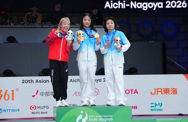 (261003) -- TOKONAME, Oct. 3, 2026 -- Gold medalist Guo Pu (C) of China, silver medalist Fukushima Ayumi (R) of Japan and bronze medalist Liu Qingyi of China pose during the awarding ceremony for the B-Girls of Breaking at 20th Asian Games Aichi-Nagoya 2026 in Tokoname of Aichi Prefecture, Japan, Oct. 3, 2026. ) (SP)JAPAN-TOKONAME-ASIAN GAMES-BREAKING-B-GIRLS CheongxKamxKa 