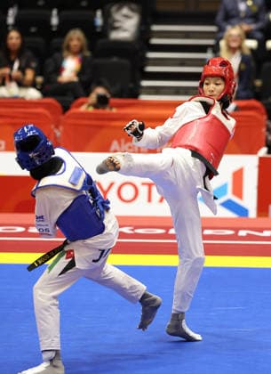 (261003) -- TOYOHASHI, Oct. 3, 2026 -- Zhang Chuling (R) of China competes with Fadia Khirfan of Jordan during the women -57kg gold medal contest of taekwondo at the 20th Asian Games Aichi-Nagoya 2026 in Toyohashi of Aichi Prefecture, Japan, Oct. 3, 2026. ) (SP)JAPAN-TOYOHASHI-ASIAN GAMES-TAEKWONDO-WOMEN S -57KG WangxFei 