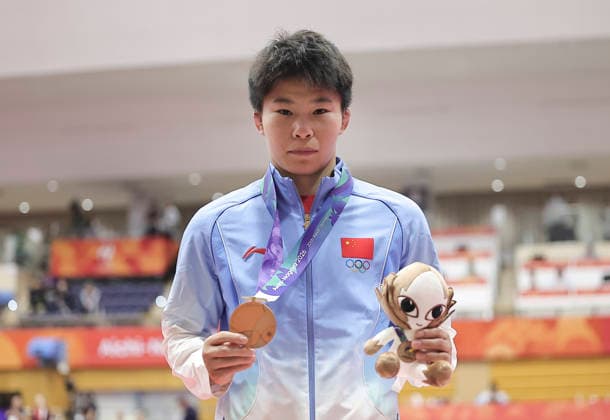 (261003) -- NAGOYA, Oct. 3, 2026 -- Bronze medalist Zhang Jin of China poses during the awarding ceremony for the women s 53kg of wrestling at the 20th Asian Games Aichi-Nagoya 2026 in Nagoya, Japan, Oct. 3, 2026. ) (SP)JAPAN-NAGOYA-ASIAN GAMES-WRESTLING-WOMEN S 57KG LongxLei 