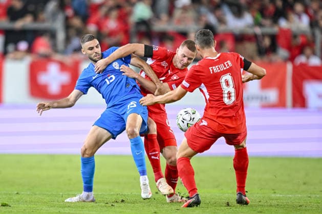 Danijel Sturm (Slovenia), Nico Elvedi (Switzerland) and Remo Freuler (Switzerland) battle for the ball during the UEFA Nations League 2026 27 group phase match between Switzerland and Slovenia at Luzern Arena on October 3, 2026 in Lucerne, Switzerland. (Photo by Harry Langer DeFodi Images) -
