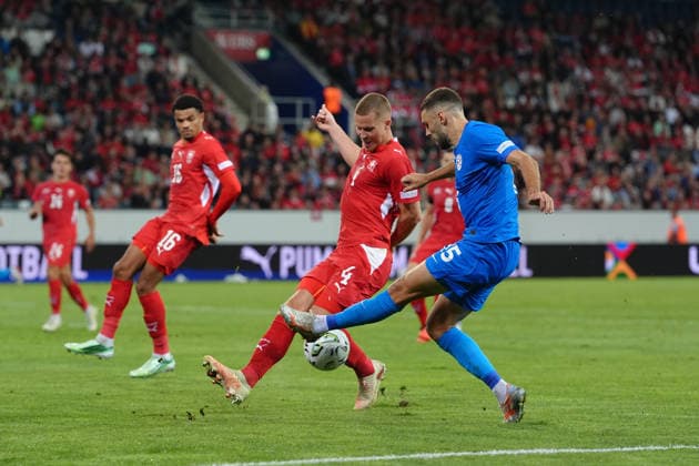 Luzern, Switzerland - October 03: Danijel Sturm (15 SLO) in duel for the ball with Nico Elvedi (4 SUI) during the UEFA Nations League match between Switzerland and Slovenia at thermoplan arena on October 03, 2026 in Luzern, Switzerland. Copyright: xKjetilxWaberx xSPPx Sportspressphoto_SPR244769