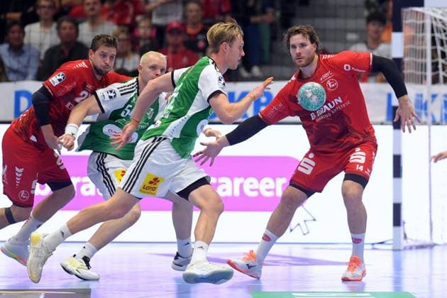 Marian Michalczik (TSV Hannover-Burgdorf 22) (am Ball), Johannes Golla (MT Melsungen 14), Justus Fischer (TSV Hannover-Burgdorf 54) (L) , GER, MT Melsungen - TSV Hannover-Burgdorf, Handball, 1. Bundesliga, 7. Spieltag, Saison 2026 2027, 03.10.2026, GER, MT Melsungen - Hannover-Burgdorf, Handball, 1. Bundesliga, 7. Spieltag, Saison 2026 2027, 03.10.2026 Kassel Copyright: xEibner-Pressefotox xRolandxSippelx EP_RSL
