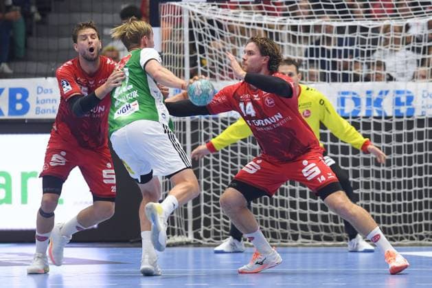 Marian Michalczik (TSV Hannover-Burgdorf 22) (am Ball), Johannes Golla (MT Melsungen 14) (R), Olle Forsell Schefvert (MT Melsungen 25) (L) , GER, MT Melsungen - TSV Hannover-Burgdorf, Handball, 1. Bundesliga, 7. Spieltag, Saison 2026 2027, 03.10.2026, GER, MT Melsungen - Hannover-Burgdorf, Handball, 1. Bundesliga, 7. Spieltag, Saison 2026 2027, 03.10.2026 Kassel Copyright: xEibner-Pressefotox xRolandxSippelx EP_RSL