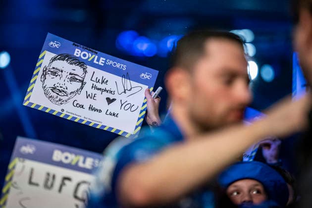 RECORD DATE NOT STATED 3rd October 2026; Mattioli Arena, Leicester, England; PDC World Grand Prix Darts Day 6; A fan holds up a drawing of Luke Humphries as he greets the fans before his semi final match against James Wade GodfreyxPitt