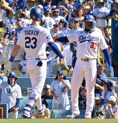 Los Angeles Dodgers Kyle Tucker celebrates with Teoscar Hernandez after hitting a 2-run home run in the sixth inning against the Atlanta Braves in game one of the National League Division Series at Dodger Stadium on Saturday, October 3, 2026 in Los Angeles, California.  LAP20261003805 JIMxRUYMEN