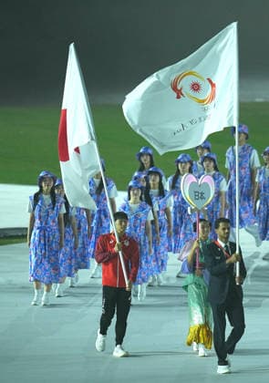 (261004) -- NAGOYA, Oct. 4, 2026 -- Flag bearers carry the flag of Olympic Council of Asia (OCA) and the national flag of Japan into the stadium during the closing ceremony of the 20th Asian Games Aichi-Nagoya 2026 in Nagoya, Japan, Oct. 4, 2026. ) (SP)JAPAN-NAGOYA-ASIAN GAMES-CLOSING CEREMONY CheongxKamxKa 