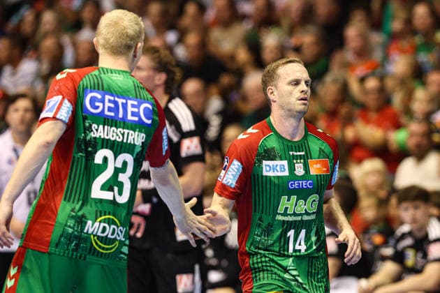 Omar Ingi Magnusson (r.,SC Magdeburg,14) und Magnus Saugstrup (SC Magdeburg,23) - Handball Bundesliga Saison 2026-2027 SC Magdeburg vs. HC Erlangen in der GETEC Arena in Magdeburg - Aktion,Handball,Deutschland,04.10.2026