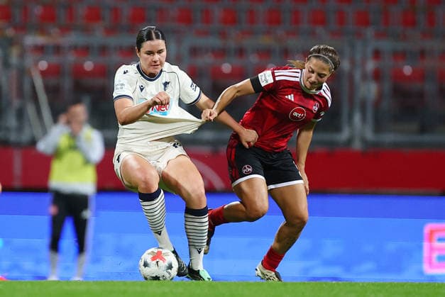October 4, 2026, Nuremberg, Bayern, Germany: Folmli Svenja of Hoffenheim ( L ) and Miller Laura of FCN ( R ) fight for the ball during the Women German Bundesliga 2026 - 2027 football match between 1.FC Nurnberg and TSG Hoffenheim at Max Morlock Stadium in Nuremberg , Bayern , Germany . October 04th , 2026 Nuremberg Germany - ZUMAe140 20261004_zip_e140_075 Copyright: xDavidexEliasx