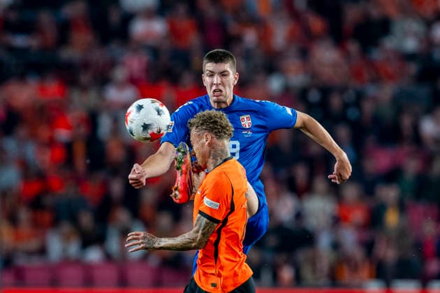 EINDHOVEN - (l-r) Nederland forward Noa Lang and Servie defender Stefan Gudelj during the UEFA Nations League match between Nederland and Servie at Philips Stadion on 4 October 2026 in Eindhoven, Nederland. (Photo by DeFodi Images) -