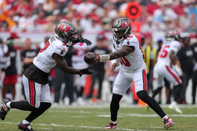 Oct 4, 2026; Tampa, FL, USA; Tampa Bay Buccaneers quarterback Jalon Daniels (10) hands the ball off to running back Bucky Irving (7) first his first NFL, American Football Herren, USA play during a game between the Green Bay Packers and Tampa Bay Buccaneers at Raymond James Stadium. Mandatory Credit: Taylor McFee-Cal Media Tampa USA - ZUMAc04_ 20261004_zma_c04_036 Copyright: xTaylorxMcfeex