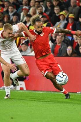Football - 2026 2027 UEFA Nations League - League A, Group Four: Wales vs. Denmark - Cardiff City Stadium - Sunday 4th October 2026 Sorba Thomas WALES bursts down the wing challenged by Adam Daghim DENMARK colorsport winston bynorth 