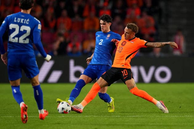 UEFA Nations League: The Netherlands v Serbia Eindhoven - Kosta Nedeljkovic of Serbia battles for possession with Noa Lang of The Netherlands during the league phase matchday 4 competition round of the 2026 2027 UEFA Nations League season. The match is set between The Netherlands and Serbia at Philips Stadion on 4 October 2026 in Eindhoven, Netherlands. (Hero Images Yannick Verhoeven) Copyright: xYannickxVerhoevenx