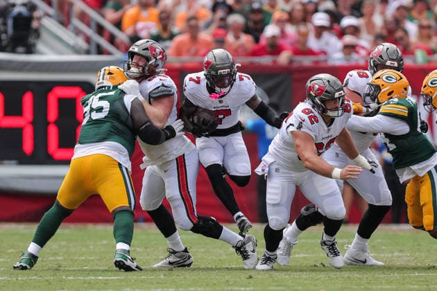 Oct 4, 2026; Tampa, FL, USA; Tampa Bay Buccaneers running back Bucky Irving (7) jumps through a small gap during the NFL, American Football Herren, USA game between the Green Bay Packers and Tampa Bay Buccaneers at Raymond James Stadium. Mandatory Credit: Taylor McFee-Cal Media Tampa USA - ZUMAc04_ 20261004_zma_c04_061 Copyright: xTaylorxMcfeex
