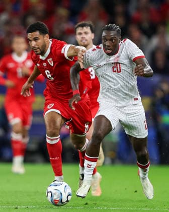 Wales v Denmark UEFA Nations League Mohamed Daramy of Denmark attacks with pressure from Ben Cabango of Wales during the UEFA Nations League match at the Cardiff City Stadium, Cardiff 04 10 2026 UK Newspapers OUT Copyright: xKaraxThomasx FIL-24028-0023