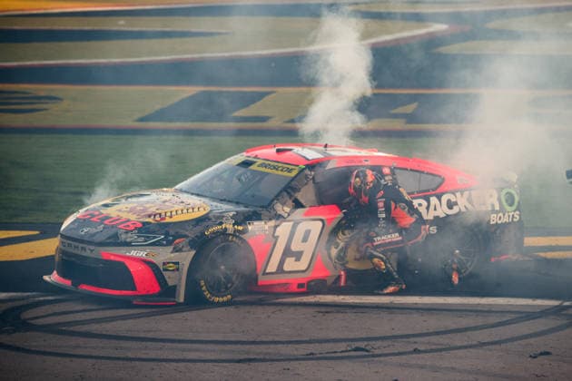LAS VEGAS, NV - OCTOBER 04: Chase Briscoe ( 19 Joe Gibbs Racing Bass Pro Shops Toyota) kneels by his car to celebrate winning the race during the NASCAR, Motorsport, USA Cup Series Playoffs South Point 400 on October 04, 2026, at Las Vegas Motor Speedway in Las Vegas, NV. (Photo by Chris Williams LVMS Icon Sportswire) AUTO: OCT 04 NASCAR Cup Series Playoffs South Point 400 EDITORIAL USE ONLY Icon0072610041250