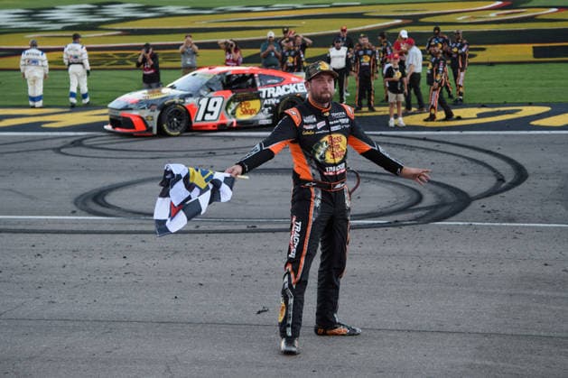 LAS VEGAS, NV - OCTOBER 04: Chase Briscoe ( 19 Joe Gibbs Racing Bass Pro Shops Toyota) takes a bow with the Sunoco checkered flag to celebrate winning the race during the NASCAR, Motorsport, USA Cup Series Playoffs South Point 400 on October 04, 2026, at Las Vegas Motor Speedway in Las Vegas, NV. (Photo by Chris Williams LVMS Icon Sportswire) AUTO: OCT 04 NASCAR Cup Series Playoffs South Point 400 EDITORIAL USE ONLY Icon0072610041269