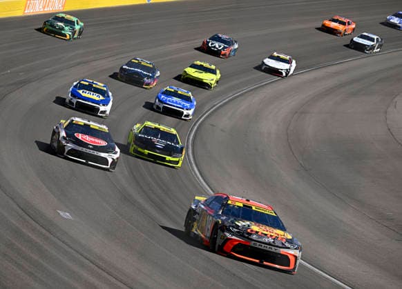 LAS VEGAS, NV - OCTOBER 04: Chase Briscoe ( 19 Joe Gibbs Racing Bass Pro Shops Toyota) leads the field through turn 3 during the early laps of the NASCAR, Motorsport, USA Cup Series Playoffs South Point 400 at Las Vegas Motor Speedway Sunday Oct. 4, 2026 in Las Vegas, Nevada. (Photo by Will Lester Icon Sportswire) AUTO: OCT 04 NASCAR Cup Series Playoffs South Point 400 EDITORIAL USE ONLY Icon26100435252