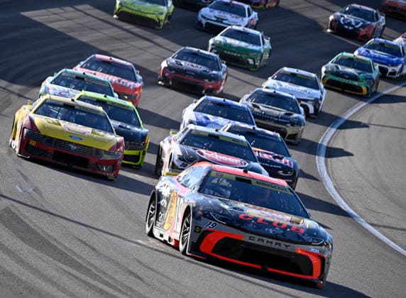 LAS VEGAS, NV - OCTOBER 04: Chase Briscoe ( 19 Joe Gibbs Racing Bass Pro Shops Toyota) leads Joey Logano ( 22 Team Penske Shell Pennzoil Ford) and Christopher Bell ( 20 Joe Gibbs Racing Rheem Toyota) out of turn 2 during the middle laps of the NASCAR, Motorsport, USA Cup Series Playoffs South Point 400 at Las Vegas Motor Speedway Sunday Oct. 4, 2026 in Las Vegas, Nevada. (Photo by Will Lester Icon Sportswire) AUTO: OCT 04 NASCAR Cup Series Playoffs South Point 400 EDITORIAL USE ONLY Icon26100441932